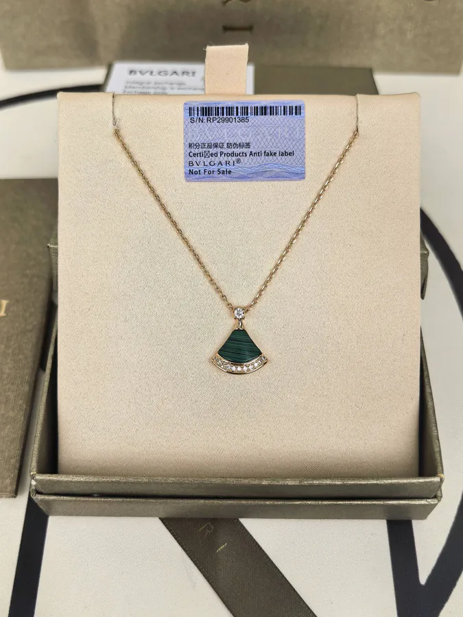 Bvlgari Dress with Peacock Stone and Diamond Necklace