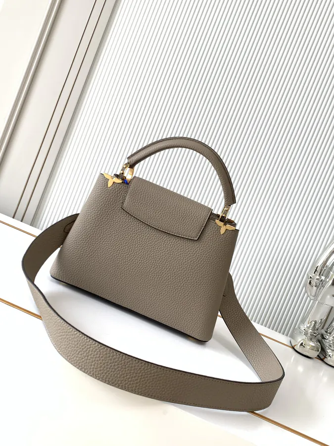 CAPUCINES Mini Handbag with Premium Leather and Elegant Gold Trim