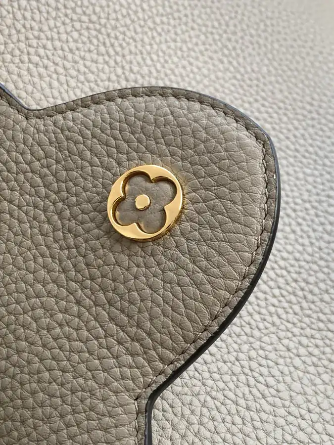 CAPUCINES Mini Handbag with Premium Leather and Elegant Gold Trim
