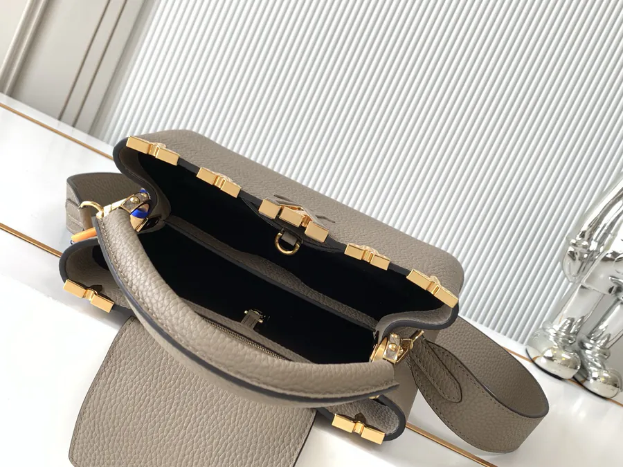 CAPUCINES Mini Handbag with Premium Leather and Elegant Gold Trim