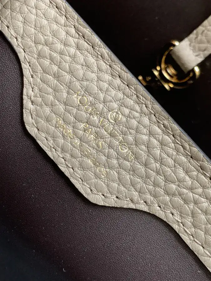 CAPUCINES Mini Handbag with Premium Leather and Elegant Gold Trim