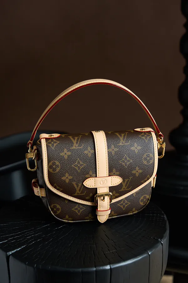 SAUMUR BB Handbag Monogram Canvas with Leather Trim