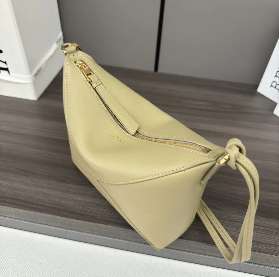 Lewell Puzzle Fold Pouch Geometric Inspired Handbag