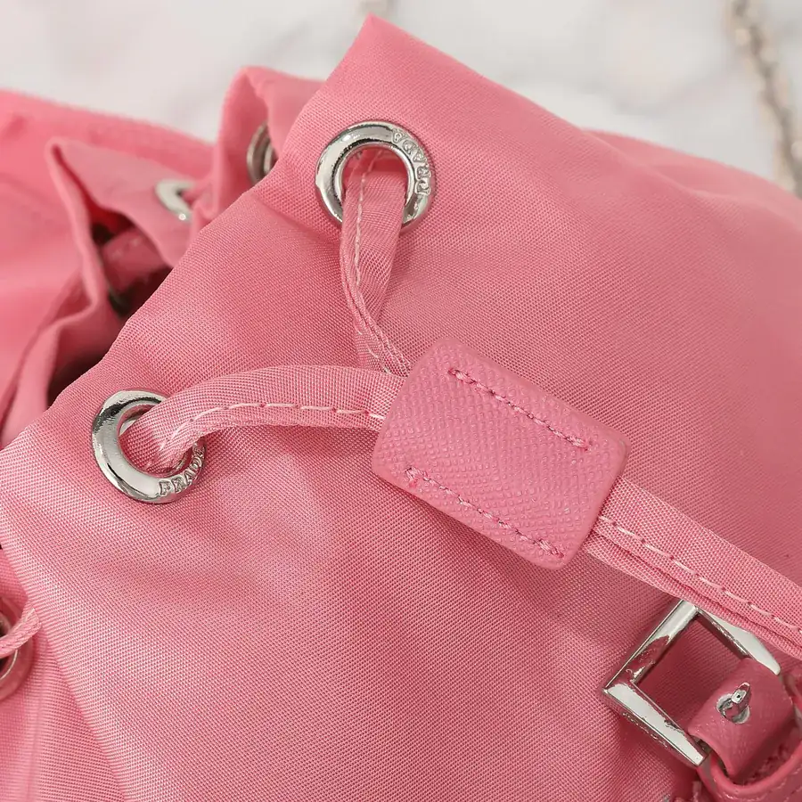 P Family New Mini Crossbody Backpack with ECONYL® Regenerated Nylon and Saffiano Leather