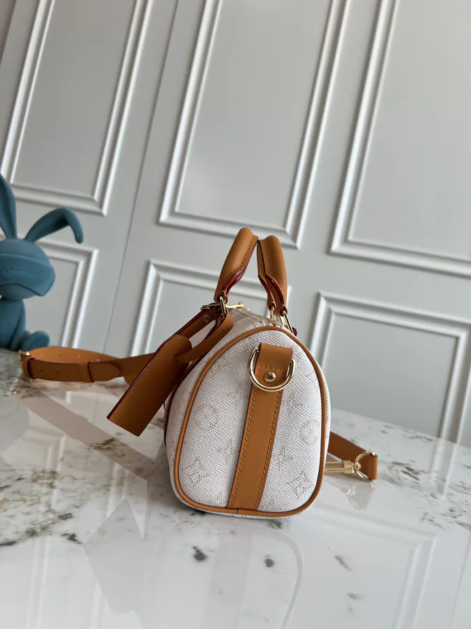 KEEALL BANDOULIÈRE 25 Handbag in Semi Handmade Material