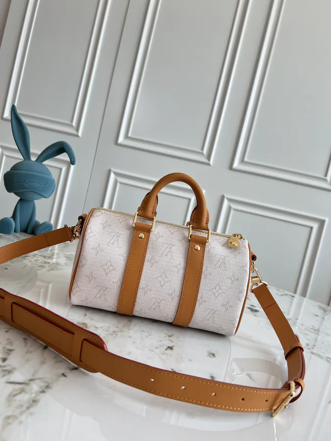 KEEALL BANDOULIÈRE 25 Handbag in Semi Handmade Material