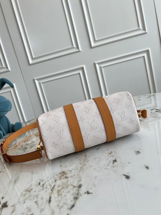 KEEALL BANDOULIÈRE 25 Handbag in Semi Handmade Material
