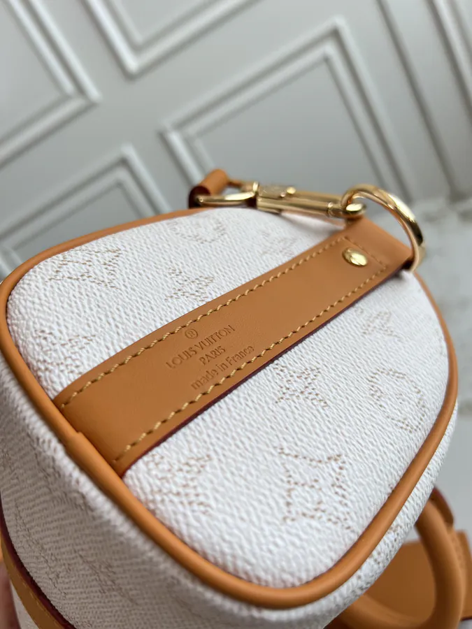 KEEALL BANDOULIÈRE 25 Handbag in Semi Handmade Material