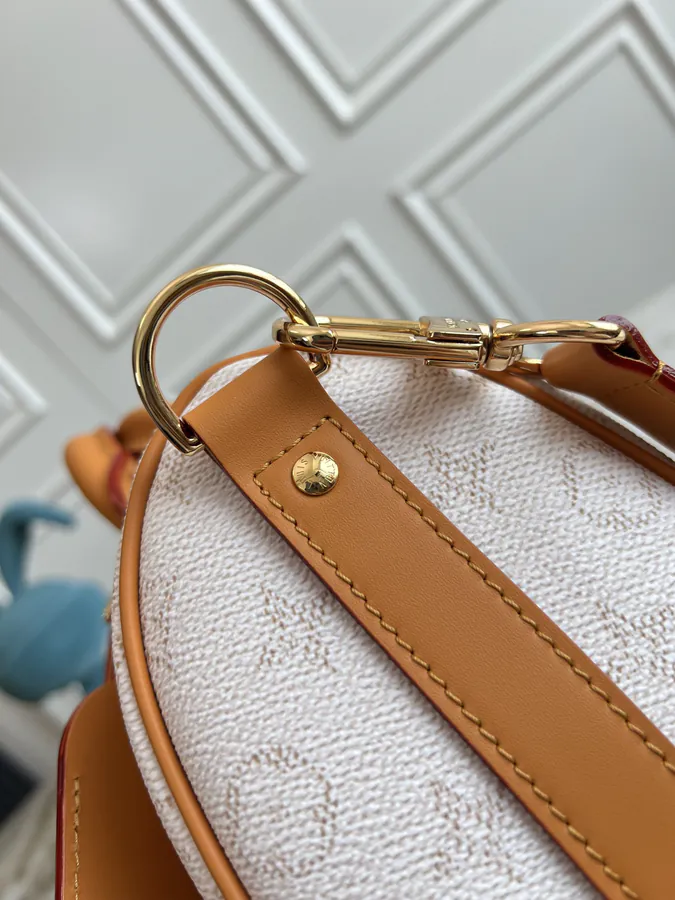 KEEALL BANDOULIÈRE 25 Handbag in Semi Handmade Material
