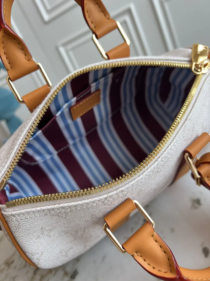 KEEALL BANDOULIÈRE 25 Handbag in Semi Handmade Material