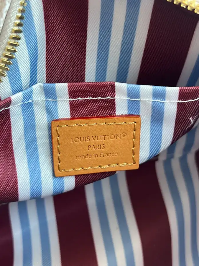 KEEALL BANDOULIÈRE 25 Handbag in Semi Handmade Material