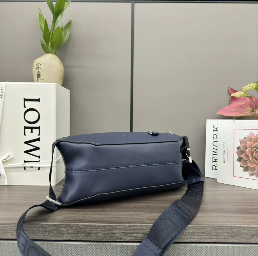 Classic Leather Sling Bag with Adjustable Strap and Metal Clasp