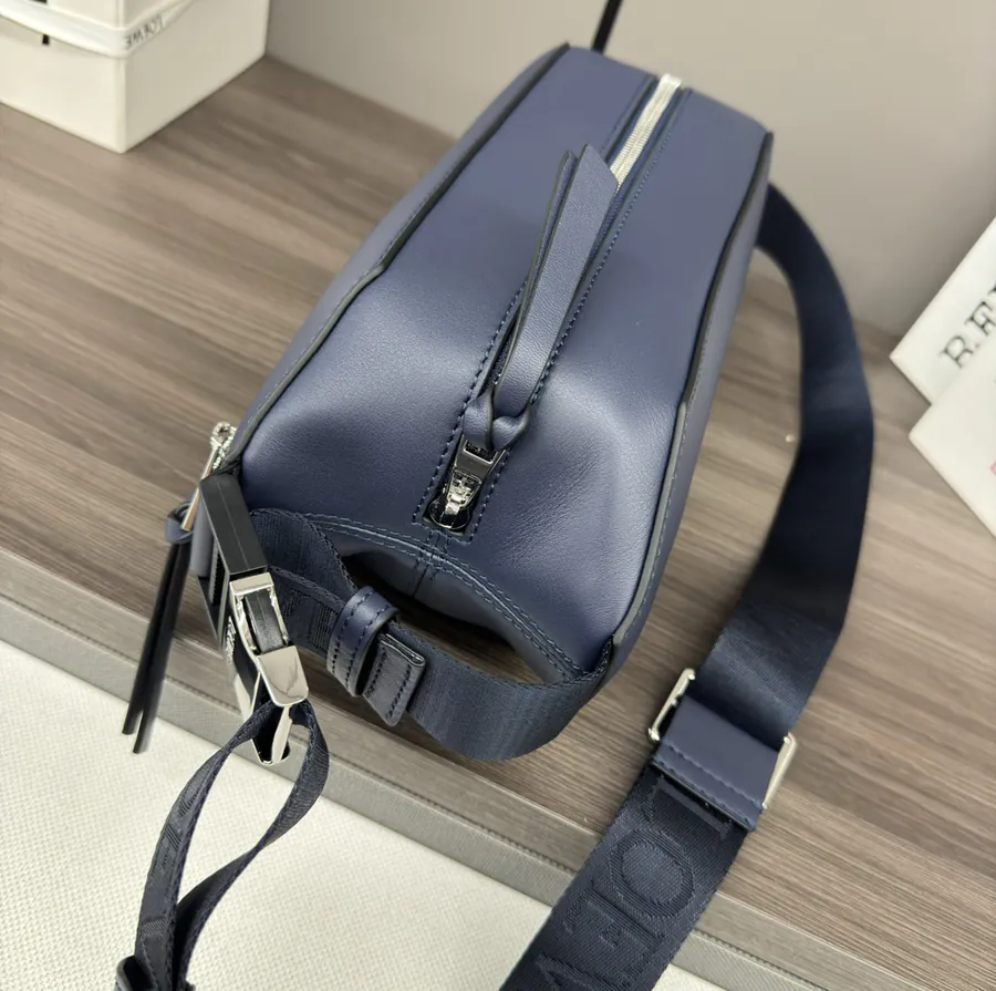 Classic Leather Sling Bag with Adjustable Strap and Metal Clasp