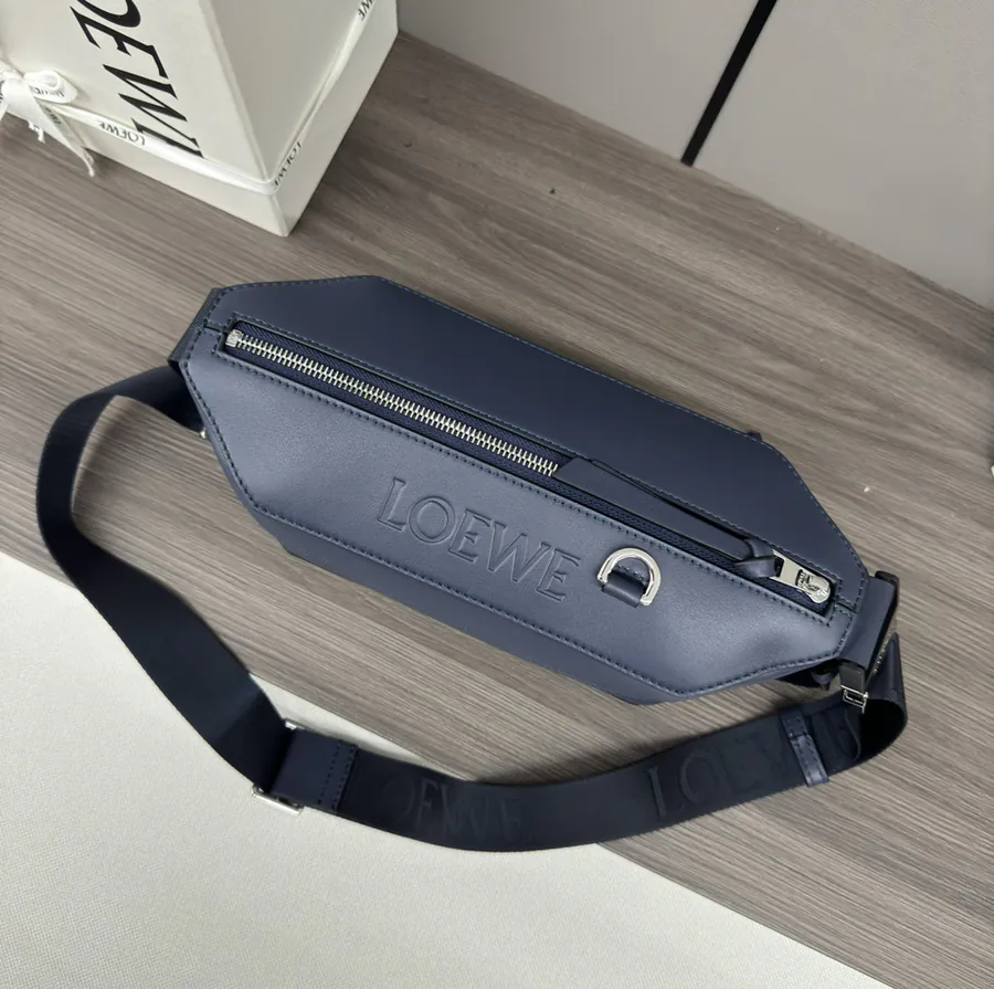 Classic Leather Sling Bag with Adjustable Strap and Metal Clasp