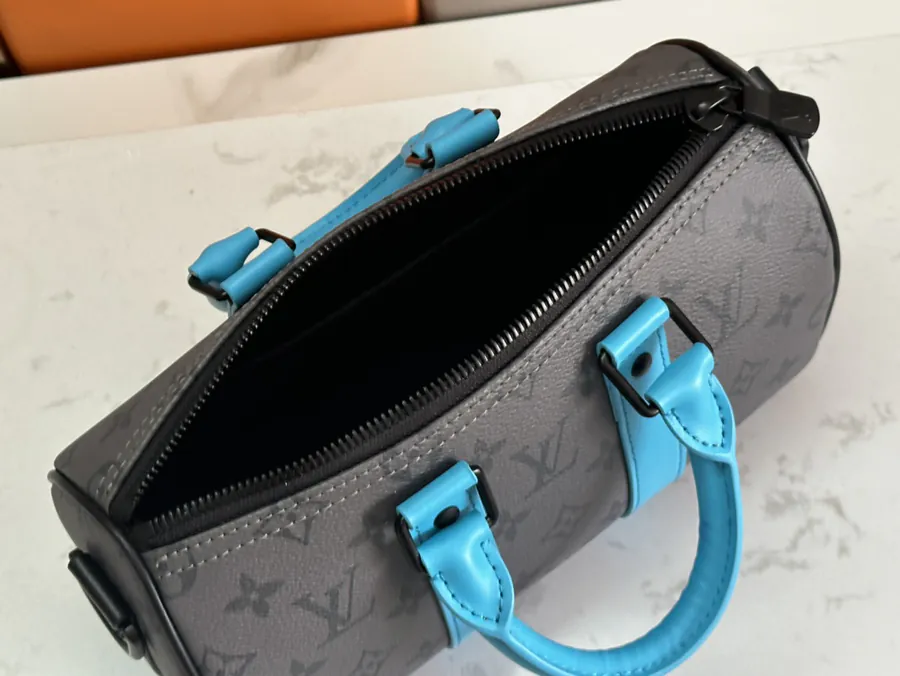 Keepall Bandoulière 25 Handbag with Monogram Eclipse Reverse Canvas and Leather Trim