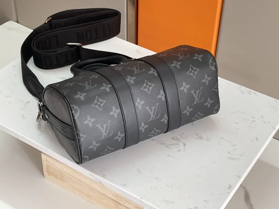 Louis Vuitton Keepall 25 Handbag with Monogram Eclipse Reverse Canvas