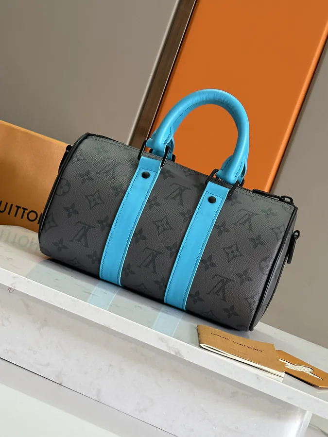 Keepall Bandoulière 25 Handbag with Monogram Eclipse Reverse Canvas and Leather Trim