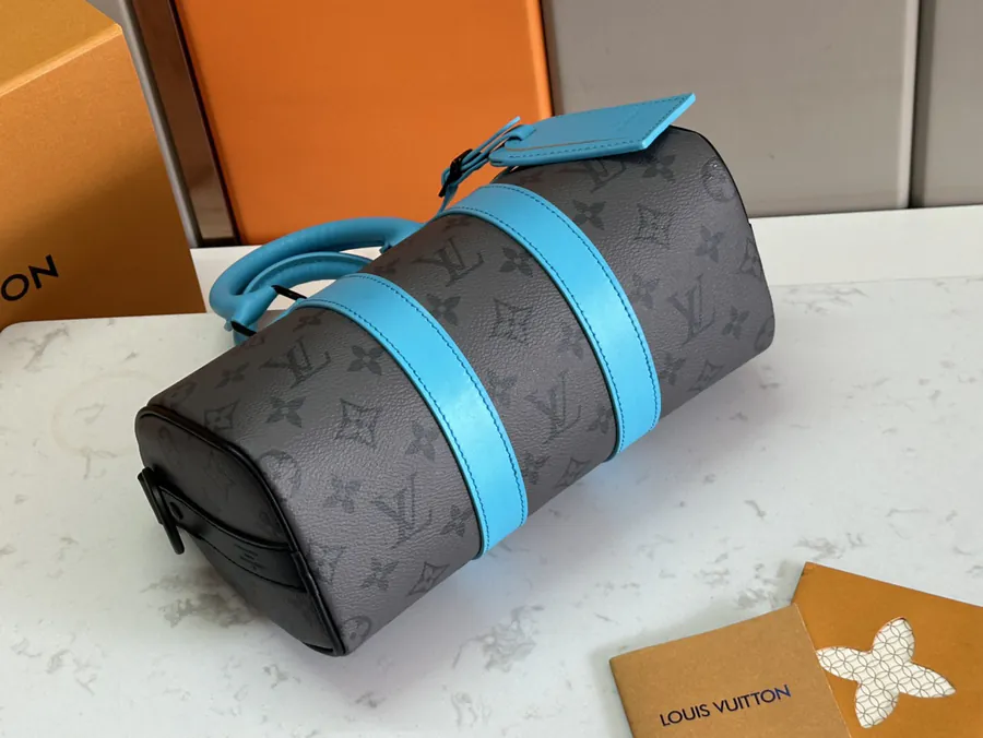 Keepall Bandoulière 25 Handbag with Monogram Eclipse Reverse Canvas and Leather Trim