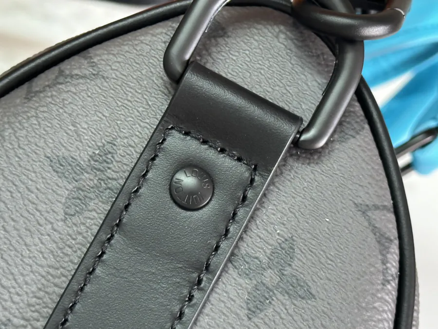 Keepall Bandoulière 25 Handbag with Monogram Eclipse Reverse Canvas and Leather Trim