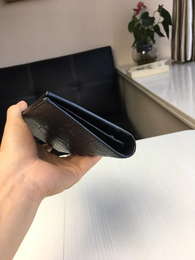 Coach Men's Folded Wallet with Embossed Design