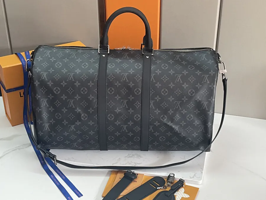 Keepall 55 Travel Bag Monogram Eclipse Canvas with Grained Calfskin Trim