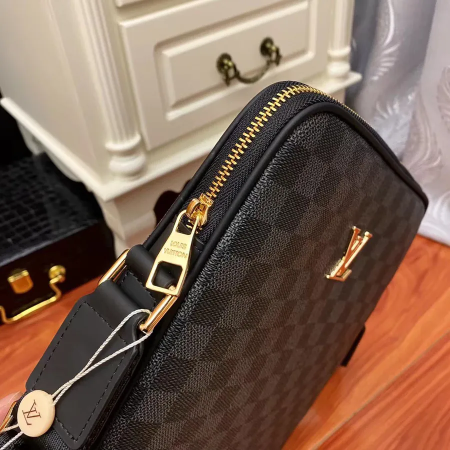 Pochette Voyage in Black Grained Calfskin