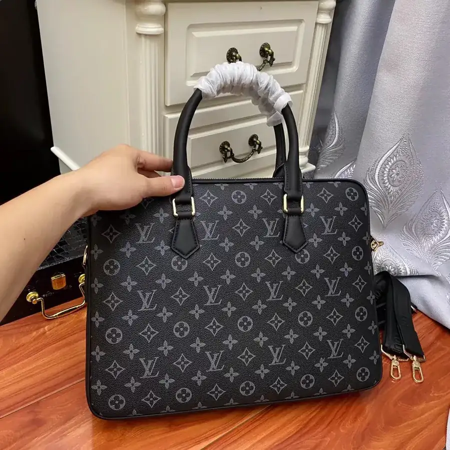 Pochette Voyage in Black Monogram Eclipse