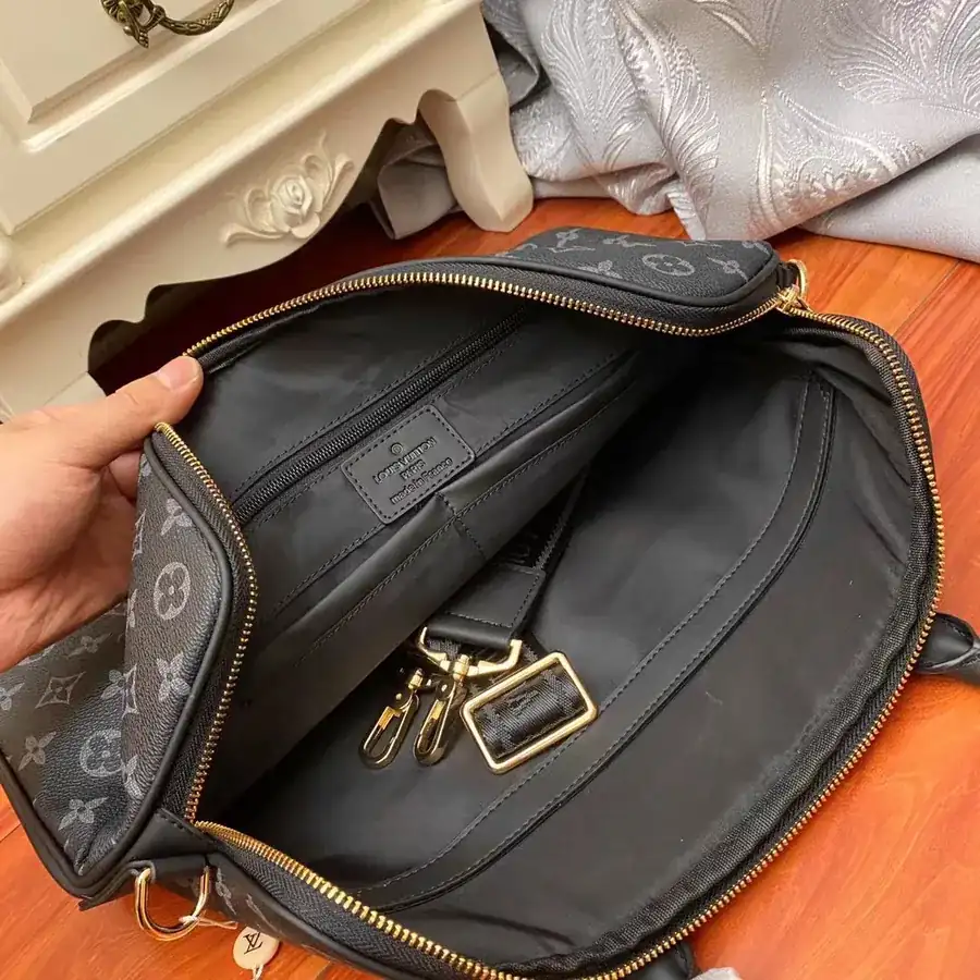 Pochette Voyage in Black Monogram Eclipse