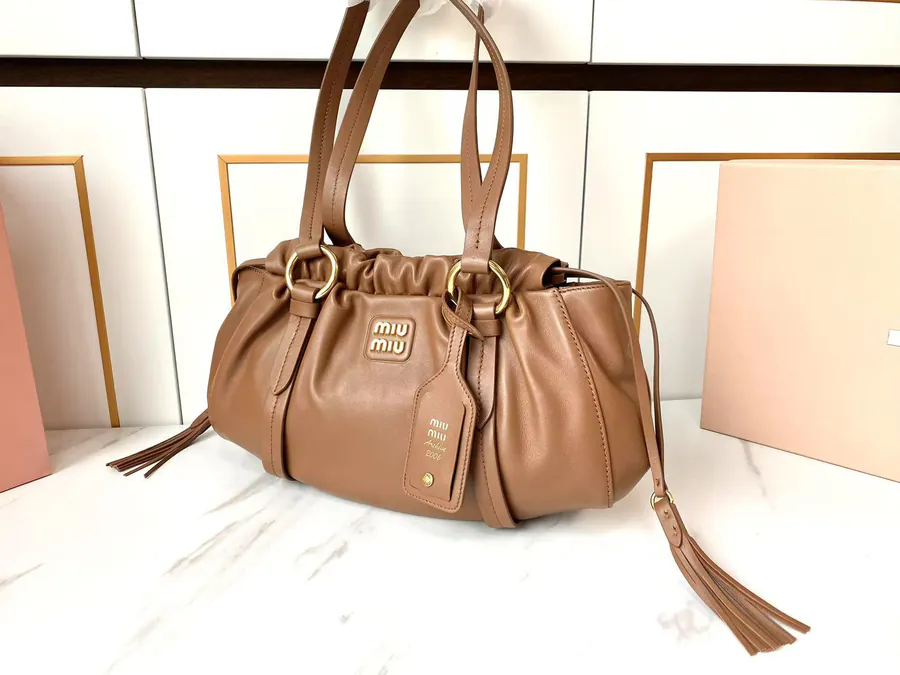 MIU Vintage Bucket Bag with Grained Calfskin and Metal Hardware