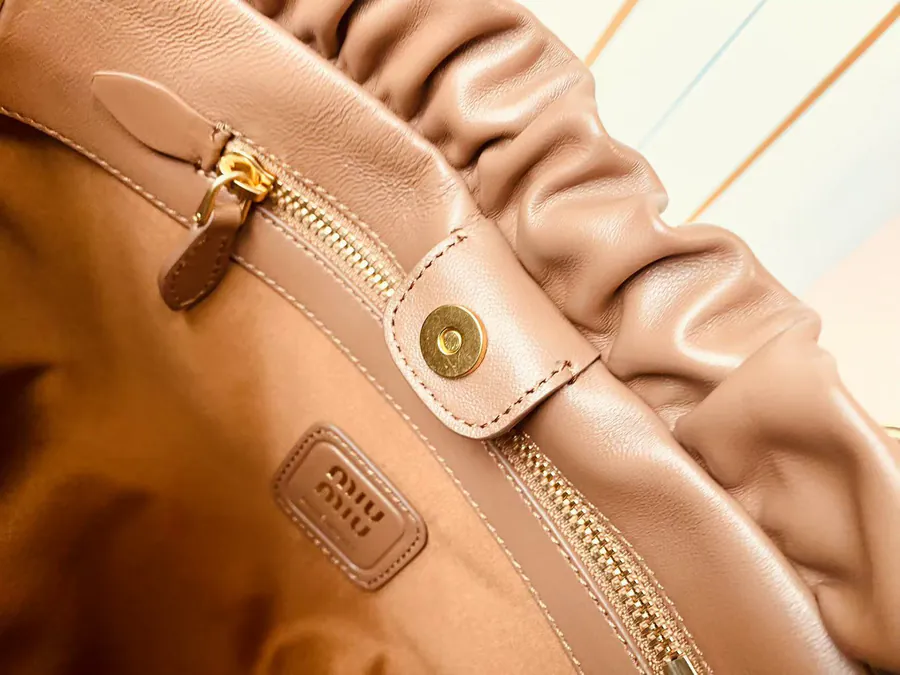 MIU Vintage Bucket Bag with Grained Calfskin and Metal Hardware