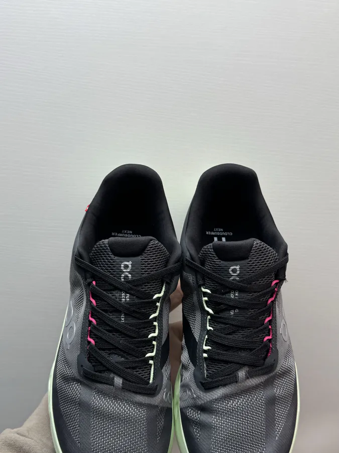 On Cloudsurfer Next in Black and Green