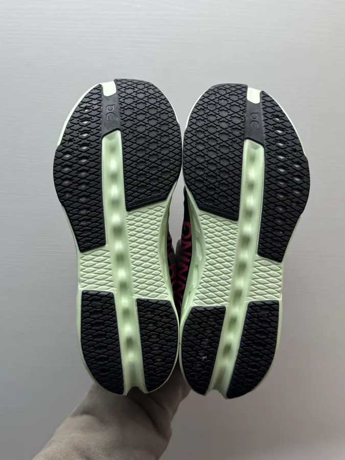 On Cloudsurfer Next in Black and Green
