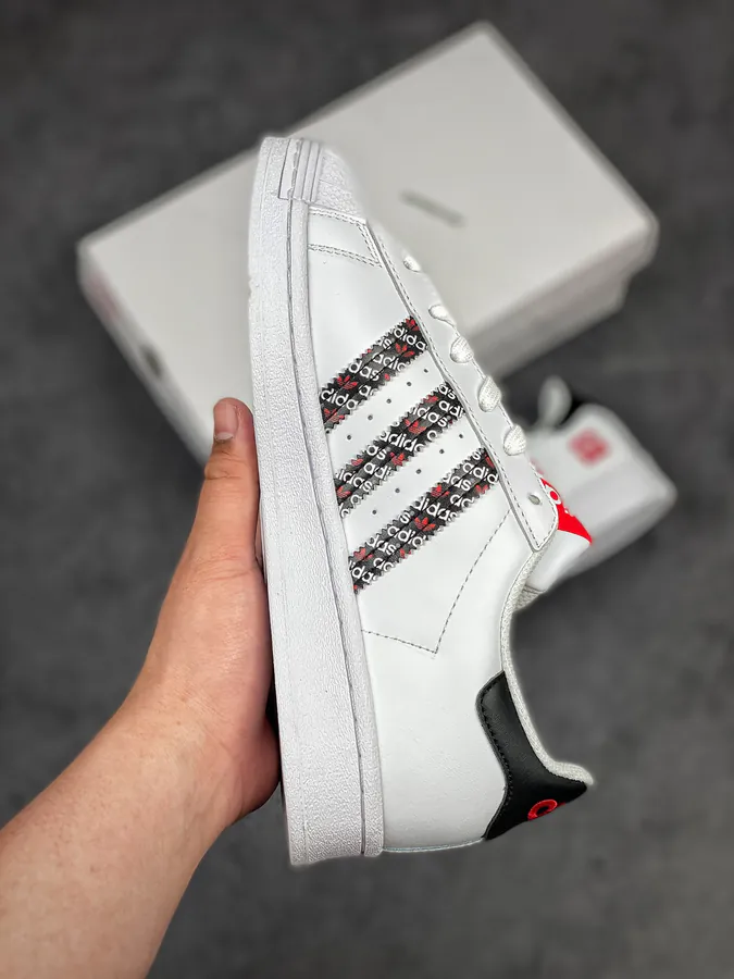 Originals Superstar Shell Toe Sneaker in WhiteBlackRed