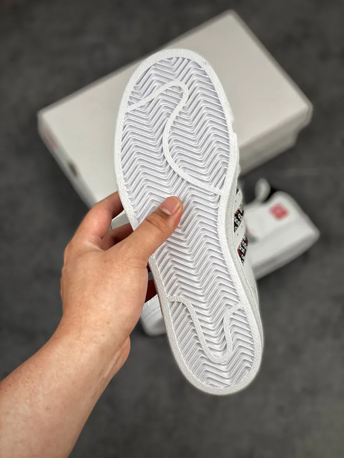 Originals Superstar Shell Toe Sneaker in WhiteBlackRed