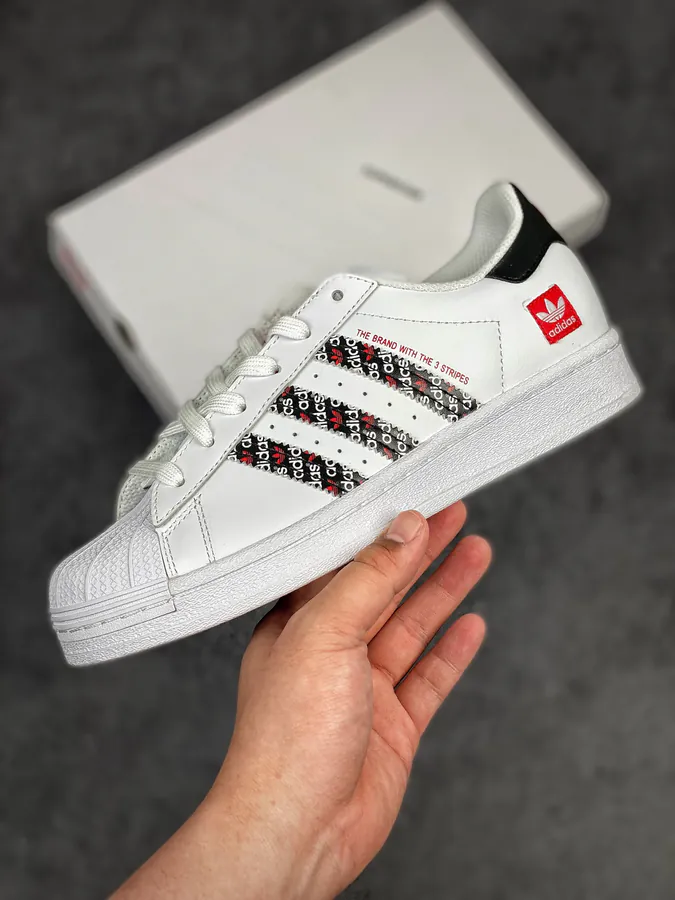 Originals Superstar Shell Toe Sneaker in WhiteBlackRed