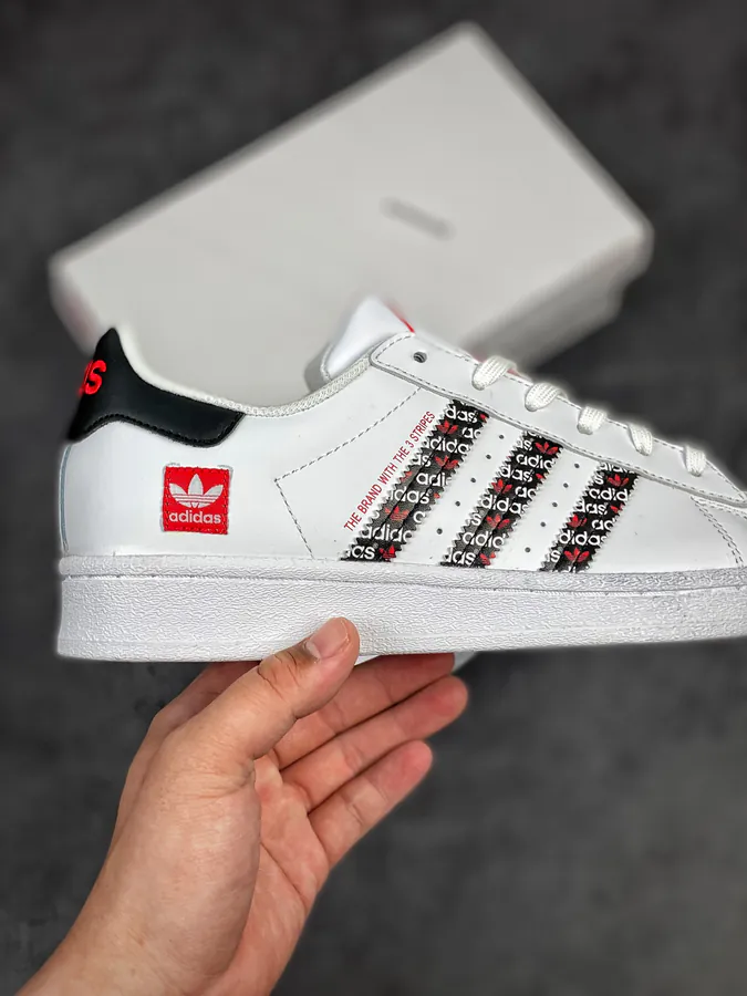 Originals Superstar Shell Toe Sneaker in WhiteBlackRed