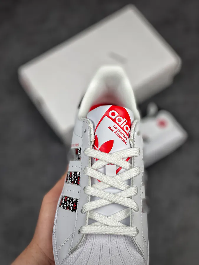 Originals Superstar Shell Toe Sneaker in WhiteBlackRed