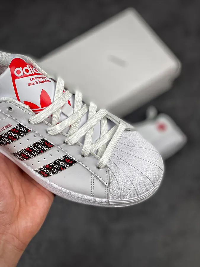 Originals Superstar Shell Toe Sneaker in WhiteBlackRed