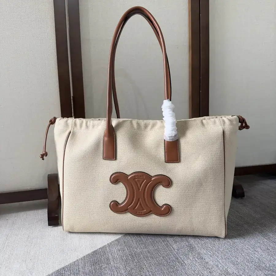 CE New Drawstring Large Shopping Bag with Soft Leather and Embossed Triumph Logo